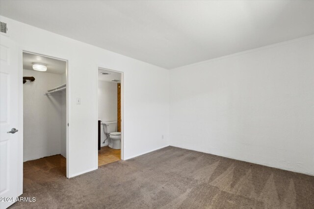 unfurnished room featuring carpet