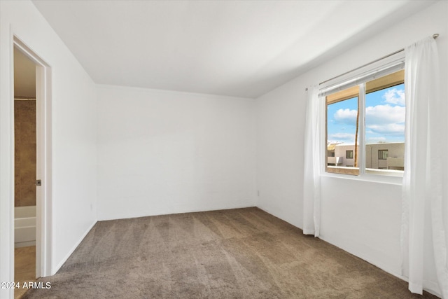 empty room featuring carpet flooring