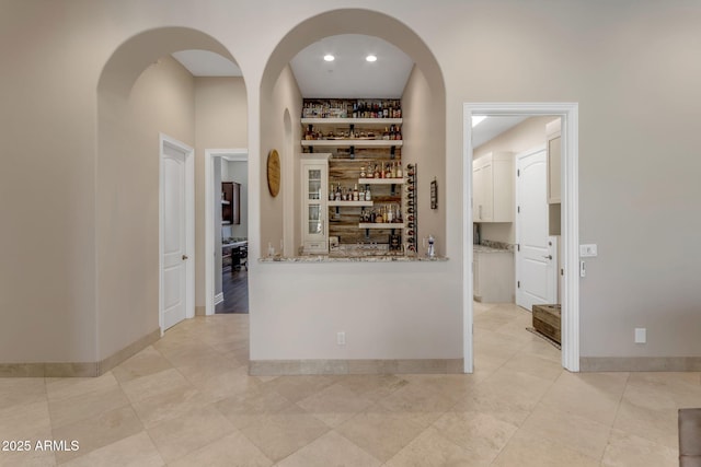 hall with light tile patterned flooring