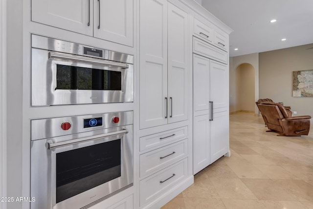 kitchen with white cabinetry and light tile patterned floors