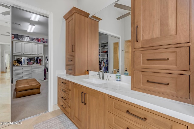 bathroom featuring tile patterned flooring and vanity