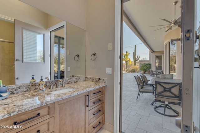 bathroom featuring vanity and ceiling fan