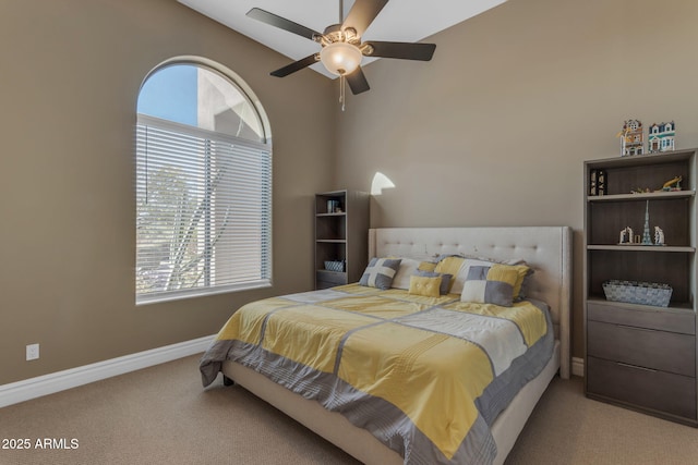 bedroom with carpet, lofted ceiling, and ceiling fan