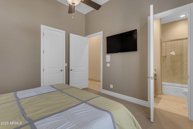 carpeted bedroom with connected bathroom and ceiling fan