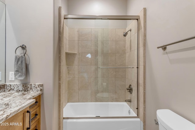 full bathroom featuring toilet, vanity, and bath / shower combo with glass door