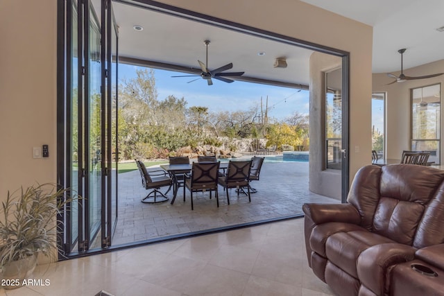 interior space featuring ceiling fan