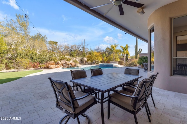 view of patio featuring ceiling fan