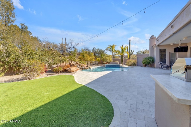 view of yard with a fenced in pool and a patio area