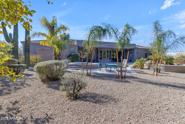 back of property featuring a patio area