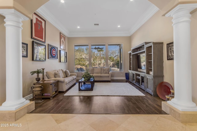 tiled living room with decorative columns and crown molding