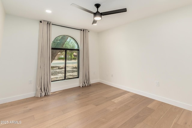 unfurnished room with a ceiling fan, light wood finished floors, baseboards, and recessed lighting