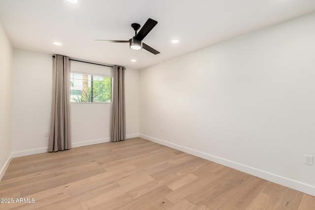 spare room featuring ceiling fan, light wood-type flooring, baseboards, and recessed lighting