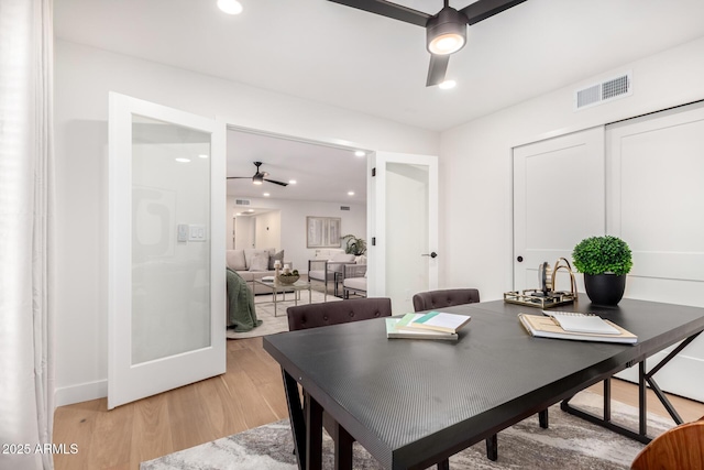 dining space featuring a ceiling fan, light wood-style flooring, recessed lighting, and baseboards