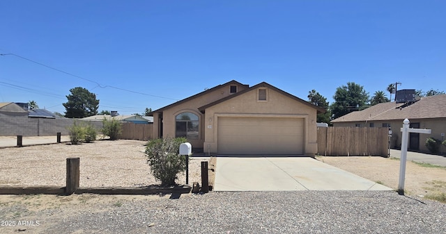 305 N Miller Rd, Buckeye, AZ 85326 - view of front of house featuring concrete driveway, stucco siding, and a garage