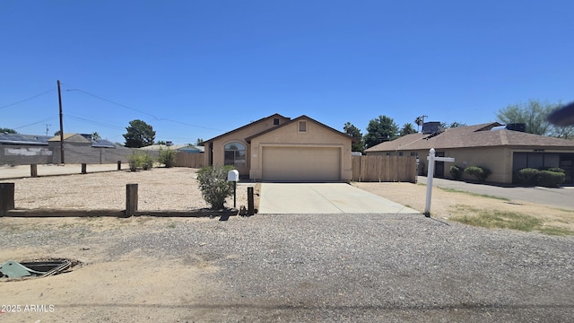 305 N Miller Rd, Buckeye, AZ 85326 - ranch-style home with concrete driveway, an attached garage, and stucco siding