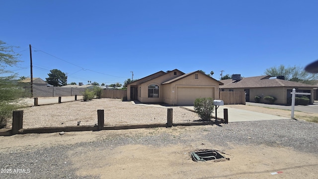 305 N Miller Rd, Buckeye, AZ 85326 - ranch-style home with a garage, driveway, and stucco siding