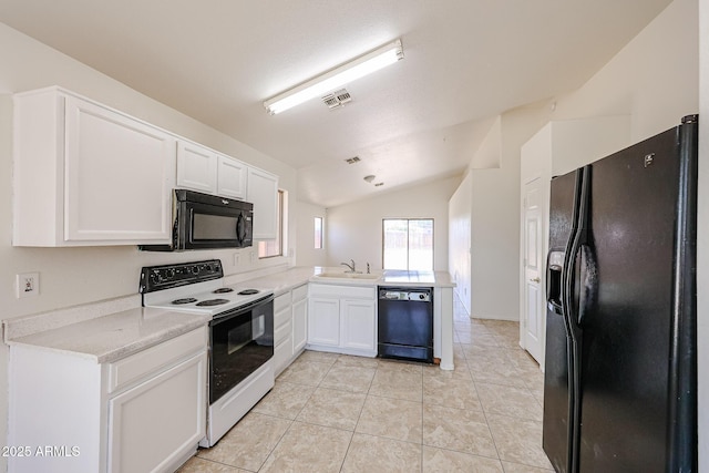 305 N Miller Rd, Buckeye, AZ 85326 - kitchen featuring black appliances, white cabinets, light countertops, a peninsula, and vaulted ceiling