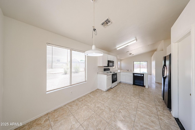 305 N Miller Rd, Buckeye, AZ 85326 - kitchen featuring black appliances, light countertops, vaulted ceiling, white cabinets, and pendant lighting