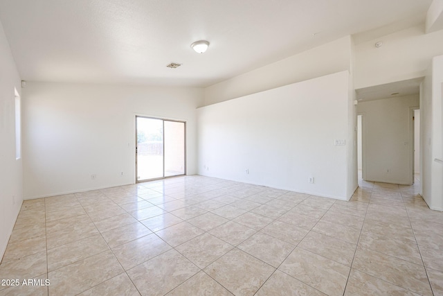 305 N Miller Rd, Buckeye, AZ 85326 - empty room with light tile patterned floors and baseboards