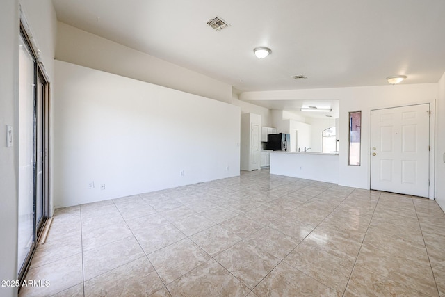 305 N Miller Rd, Buckeye, AZ 85326 - unfurnished living room featuring light tile patterned floors