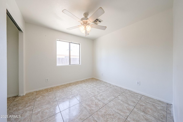 305 N Miller Rd, Buckeye, AZ 85326 - unfurnished bedroom with a closet, light tile patterned flooring, and ceiling fan