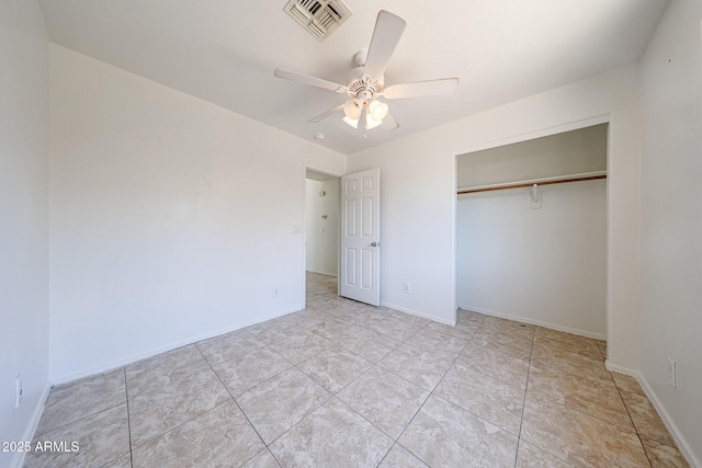305 N Miller Rd, Buckeye, AZ 85326 - unfurnished bedroom featuring a closet, ceiling fan, and tile patterned flooring