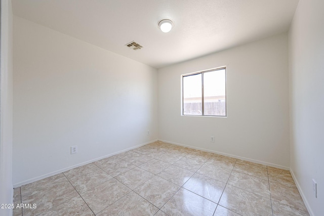 305 N Miller Rd, Buckeye, AZ 85326 - spare room with light tile patterned flooring and baseboards