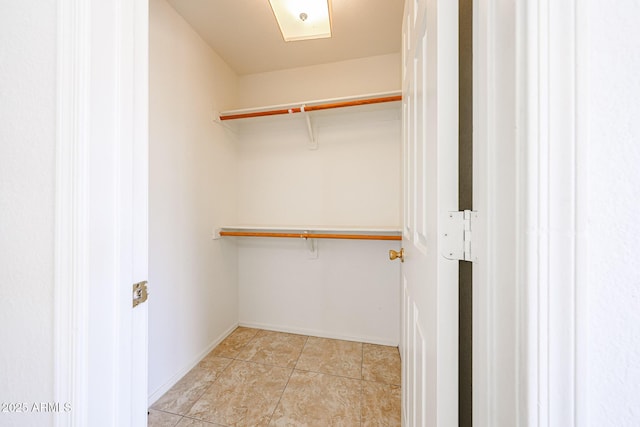 305 N Miller Rd, Buckeye, AZ 85326 - walk in closet featuring light tile patterned floors