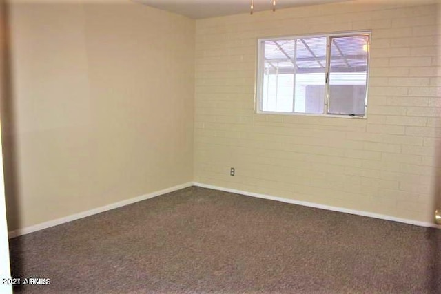 11201 W Missouri Ave, Youngtown, AZ 85363 - empty room featuring baseboards and dark carpet
