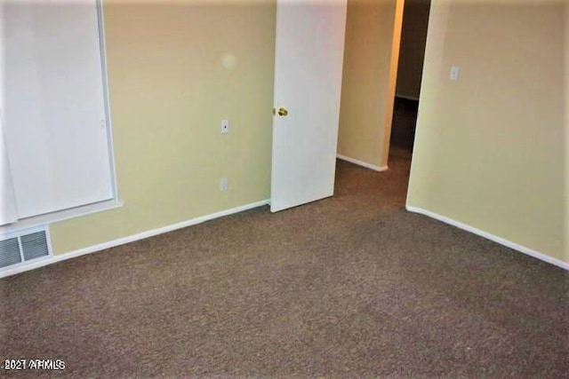 11201 W Missouri Ave, Youngtown, AZ 85363 - unfurnished room featuring baseboards, carpet flooring, and visible vents