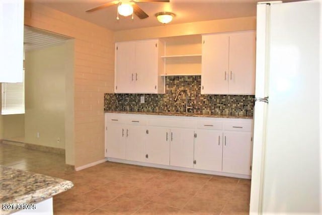 11201 W Missouri Ave, Youngtown, AZ 85363 - kitchen featuring freestanding refrigerator, backsplash, ceiling fan, and a sink