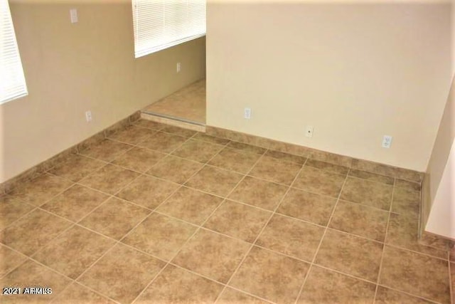 11201 W Missouri Ave, Youngtown, AZ 85363 - spare room featuring a wealth of natural light