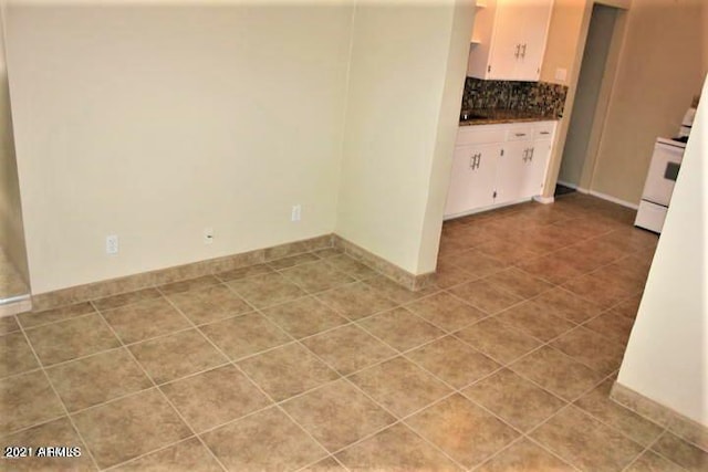 11201 W Missouri Ave, Youngtown, AZ 85363 - interior space featuring baseboards and light tile patterned floors