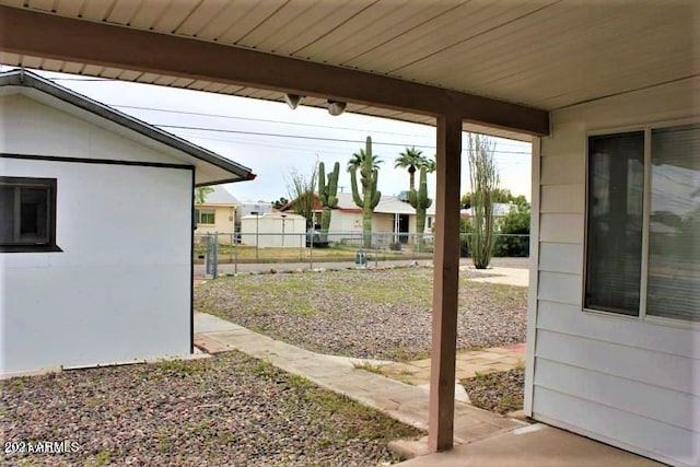 11201 W Missouri Ave, Youngtown, AZ 85363 - view of yard featuring fence and a patio area