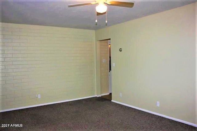 11201 W Missouri Ave, Youngtown, AZ 85363 - unfurnished room with ceiling fan, baseboards, and dark colored carpet