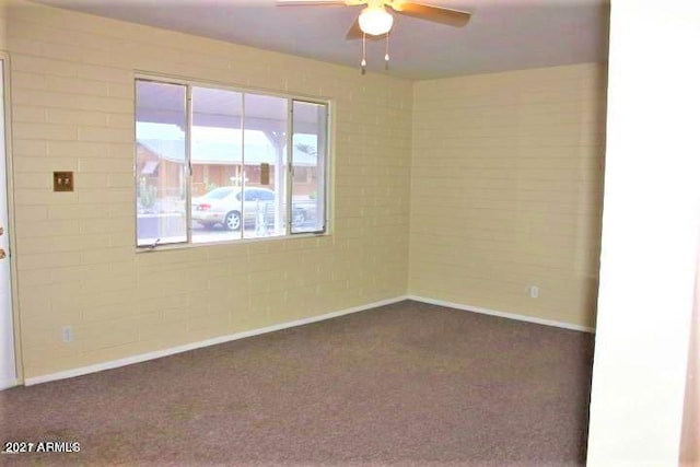 11201 W Missouri Ave, Youngtown, AZ 85363 - unfurnished room featuring baseboards, ceiling fan, and dark colored carpet