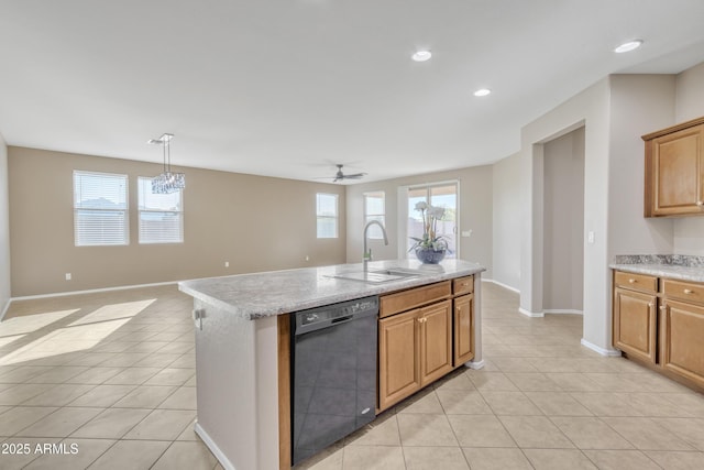 kitchen featuring a kitchen island with sink, sink, light tile patterned floors, and dishwasher