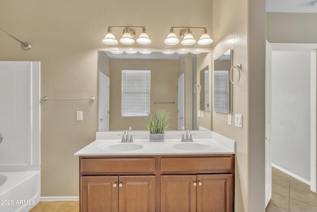 bathroom with vanity, tile patterned flooring, and shower / washtub combination