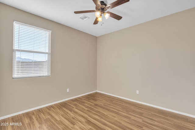 spare room with ceiling fan and light hardwood / wood-style flooring