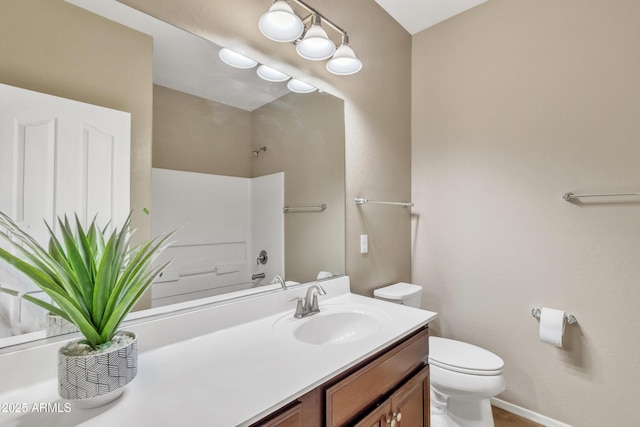 bathroom featuring vanity and toilet