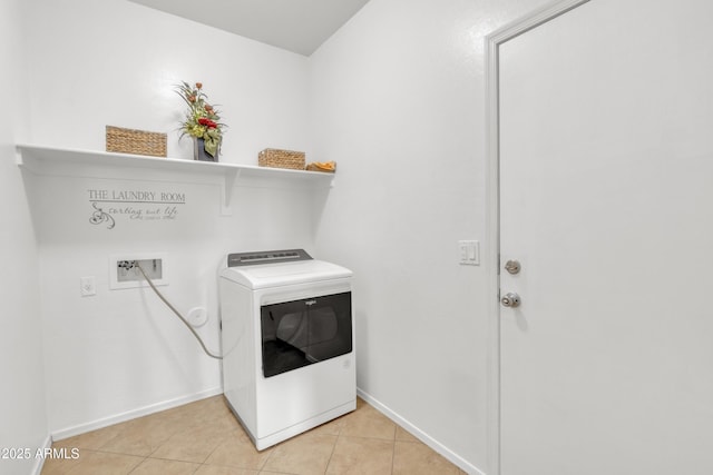 laundry area featuring washer / dryer and light tile patterned floors