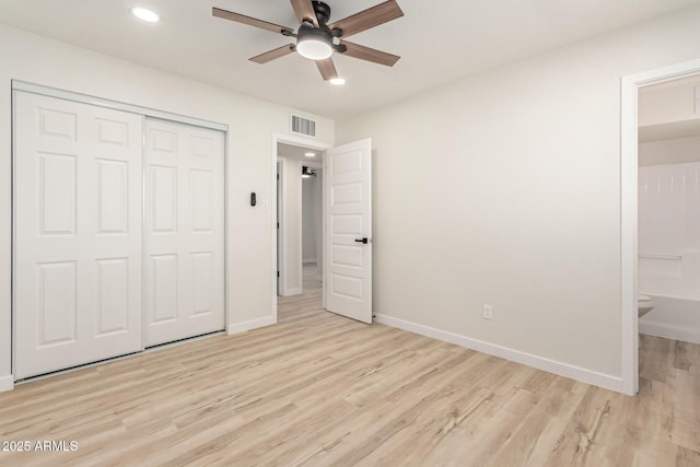 unfurnished bedroom featuring visible vents, baseboards, light wood-style flooring, a closet, and recessed lighting