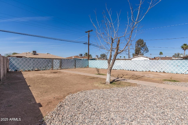 view of yard with a fenced backyard