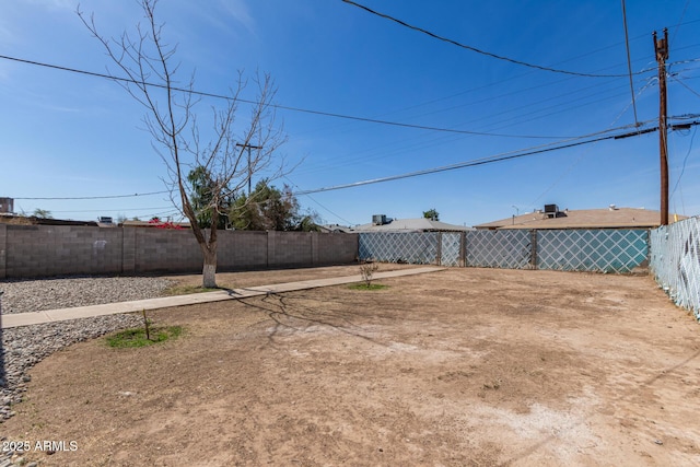 view of yard with a fenced backyard