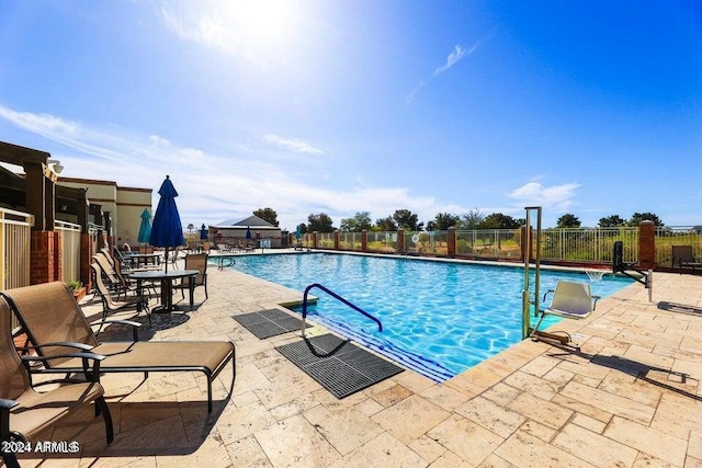 view of swimming pool featuring a patio