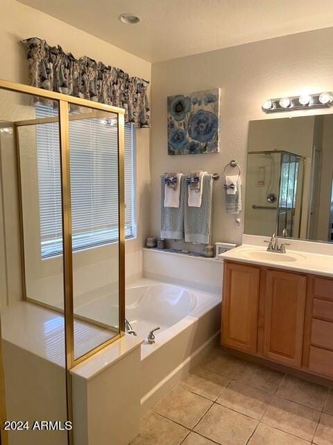 full bath with vanity, tile patterned floors, and a bath