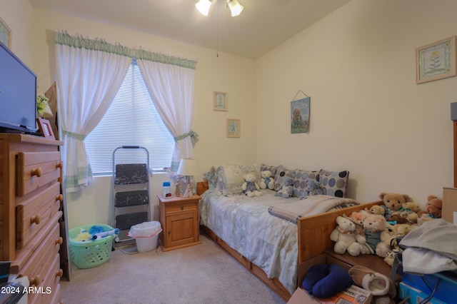 bedroom featuring light colored carpet