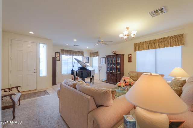 living room featuring recessed lighting, visible vents, light carpet, and a chandelier