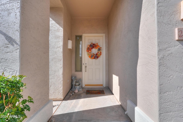 doorway to property with stucco siding