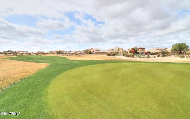 surrounding community featuring view of golf course